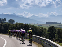 Switzerland-Day-2-Back-Shot-of-Single-File-10-Riders-Cycling-on-Highway